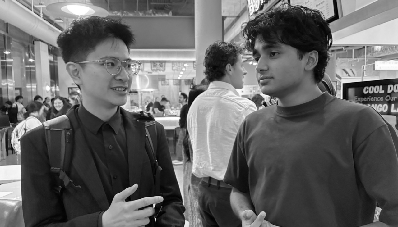 Golden in conversation with an engineer at a Philadelphia networking event